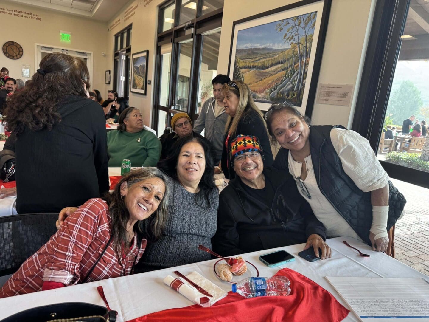 Group of people smiling at a gathering.