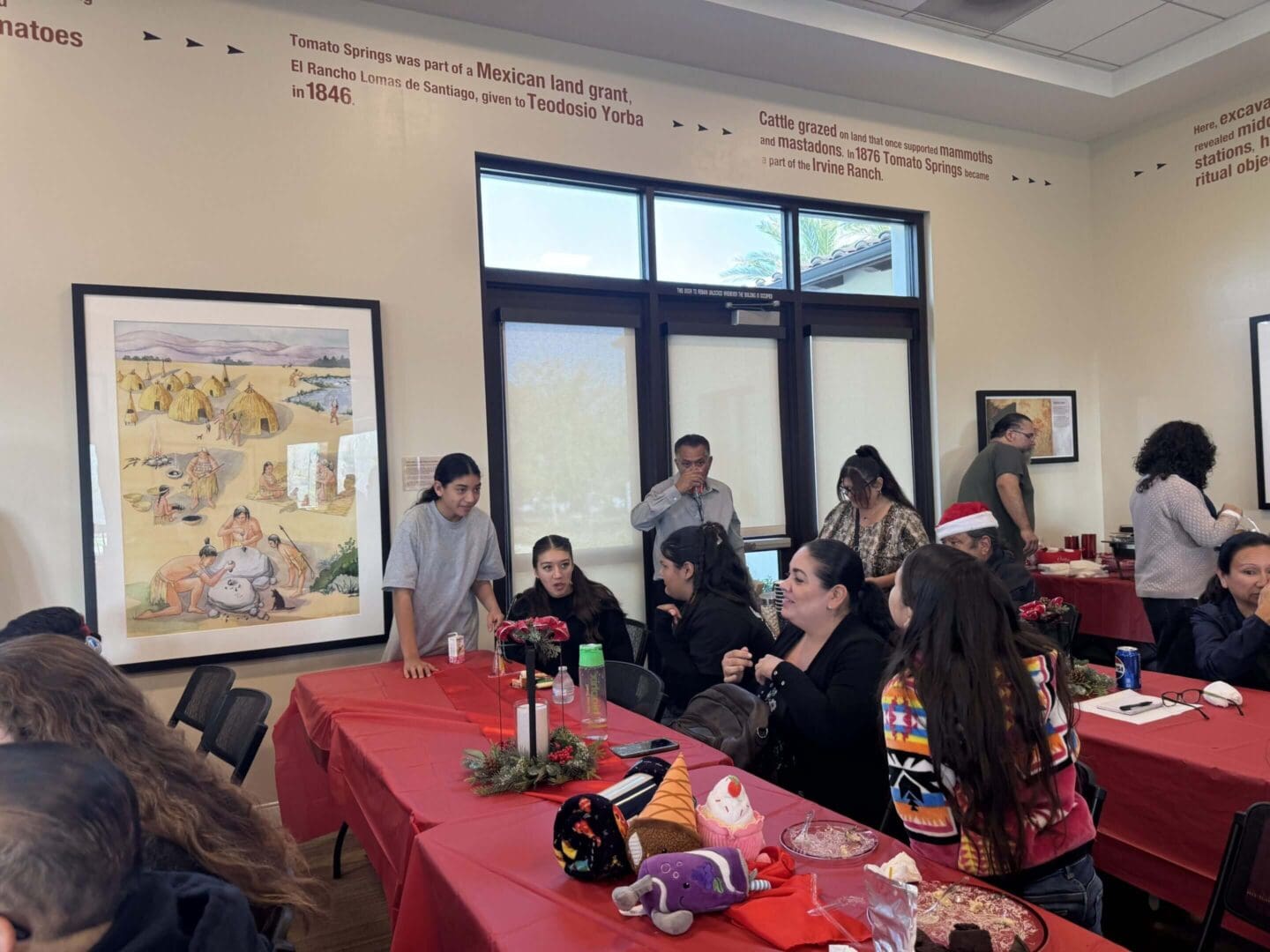 Group gathering at a festive indoor event.