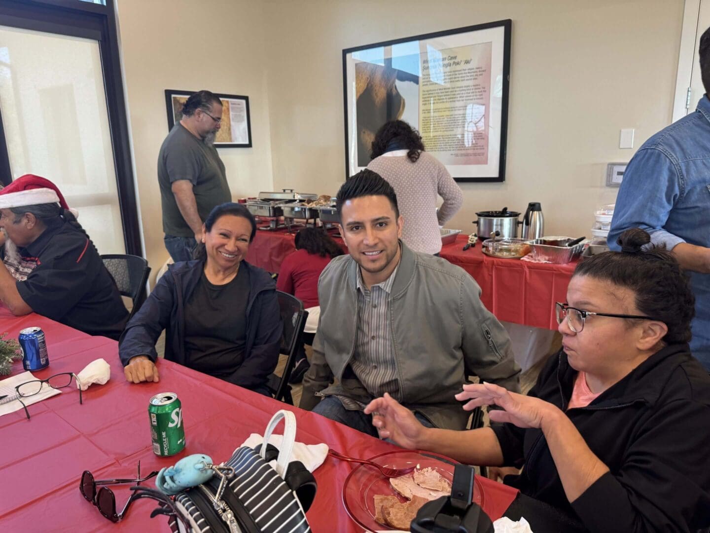 People enjoying food at a gathering.