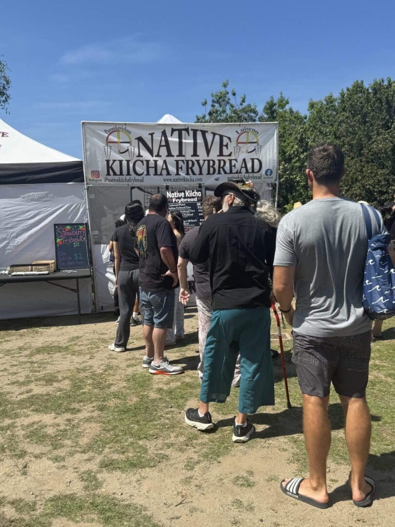 People lined up at frybread stand.